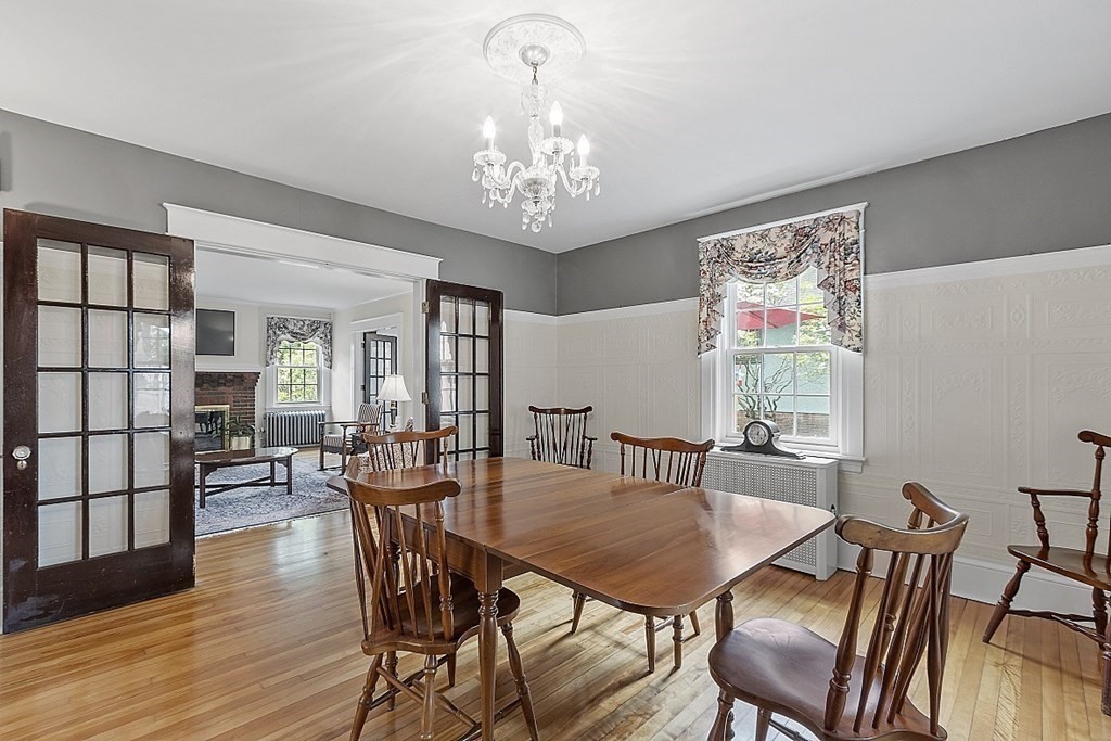 65 Commodore Road Worcester, MA 01602 - Photo 16 of 33 a view of a dining room with furniture wooden floor and chandelier