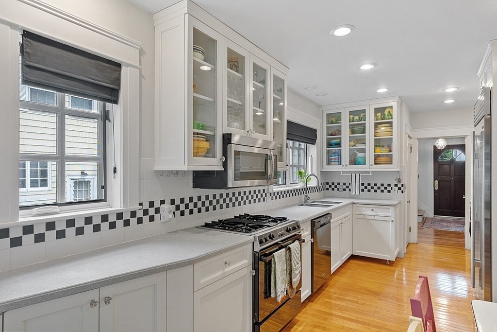 65 Commodore Road Worcester, MA 01602 - Photo 19 of 33 a kitchen with stainless steel appliances granite countertop a sink and a stove