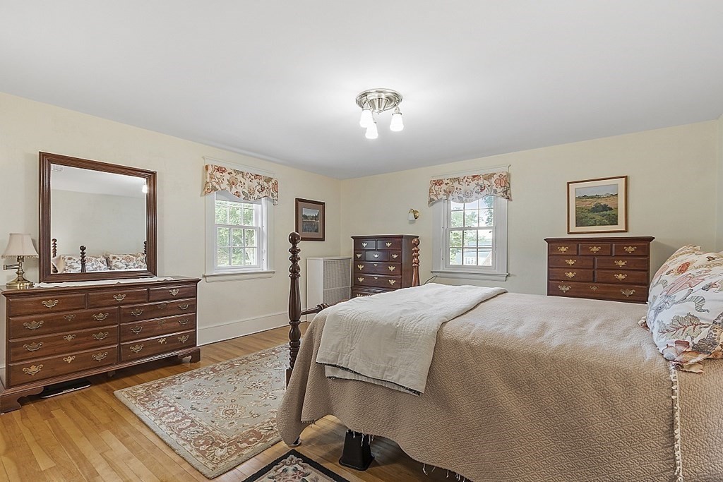 65 Commodore Road Worcester, MA 01602 - Photo 21 of 33 a bedroom with a bed and wooden floor