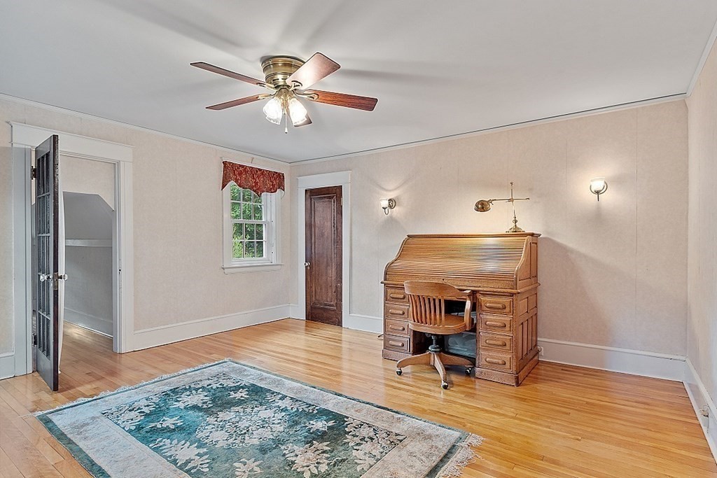65 Commodore Road Worcester, MA 01602 - Photo 23 of 33 a view of a livingroom with furniture and a ceiling fan