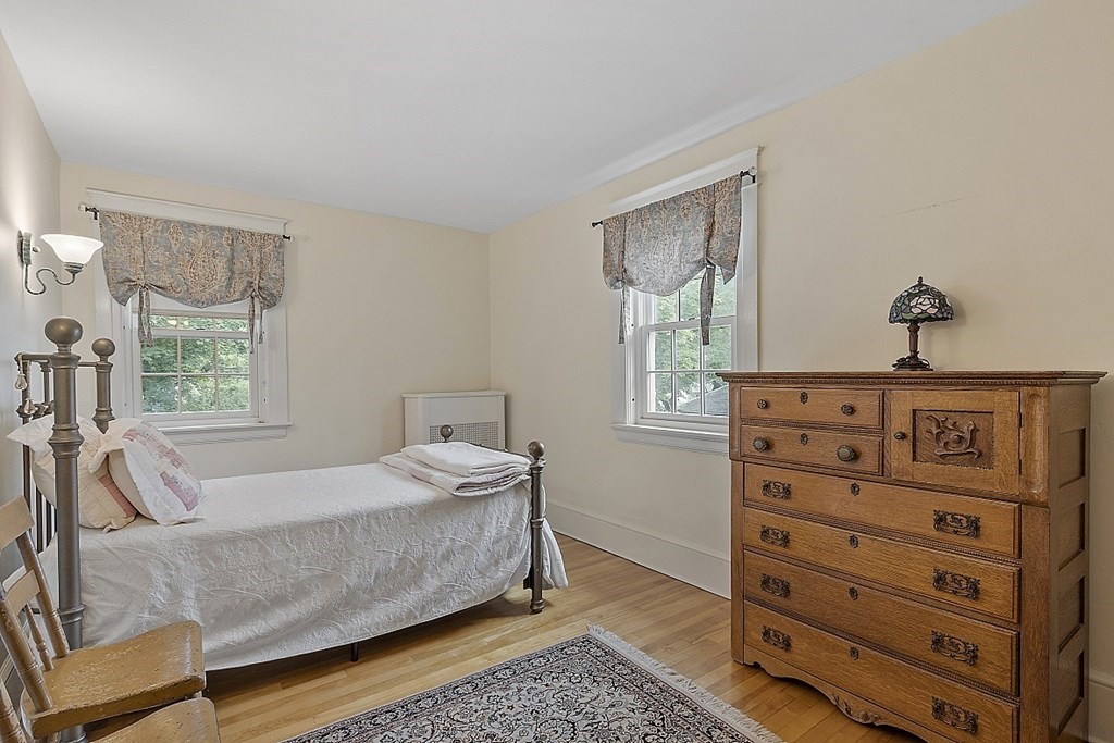 65 Commodore Road Worcester, MA 01602 - Photo 28 of 33 a bedroom with a bed and a dresser