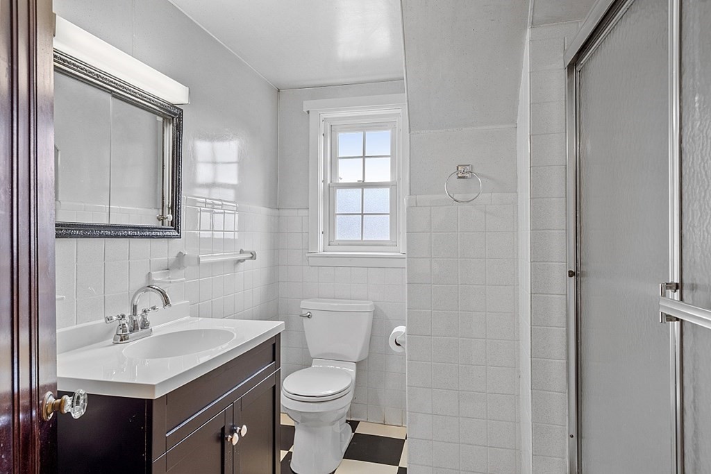 65 Commodore Road Worcester, MA 01602 - Photo 33 of 33 a bathroom with a sink toilet and vanity
