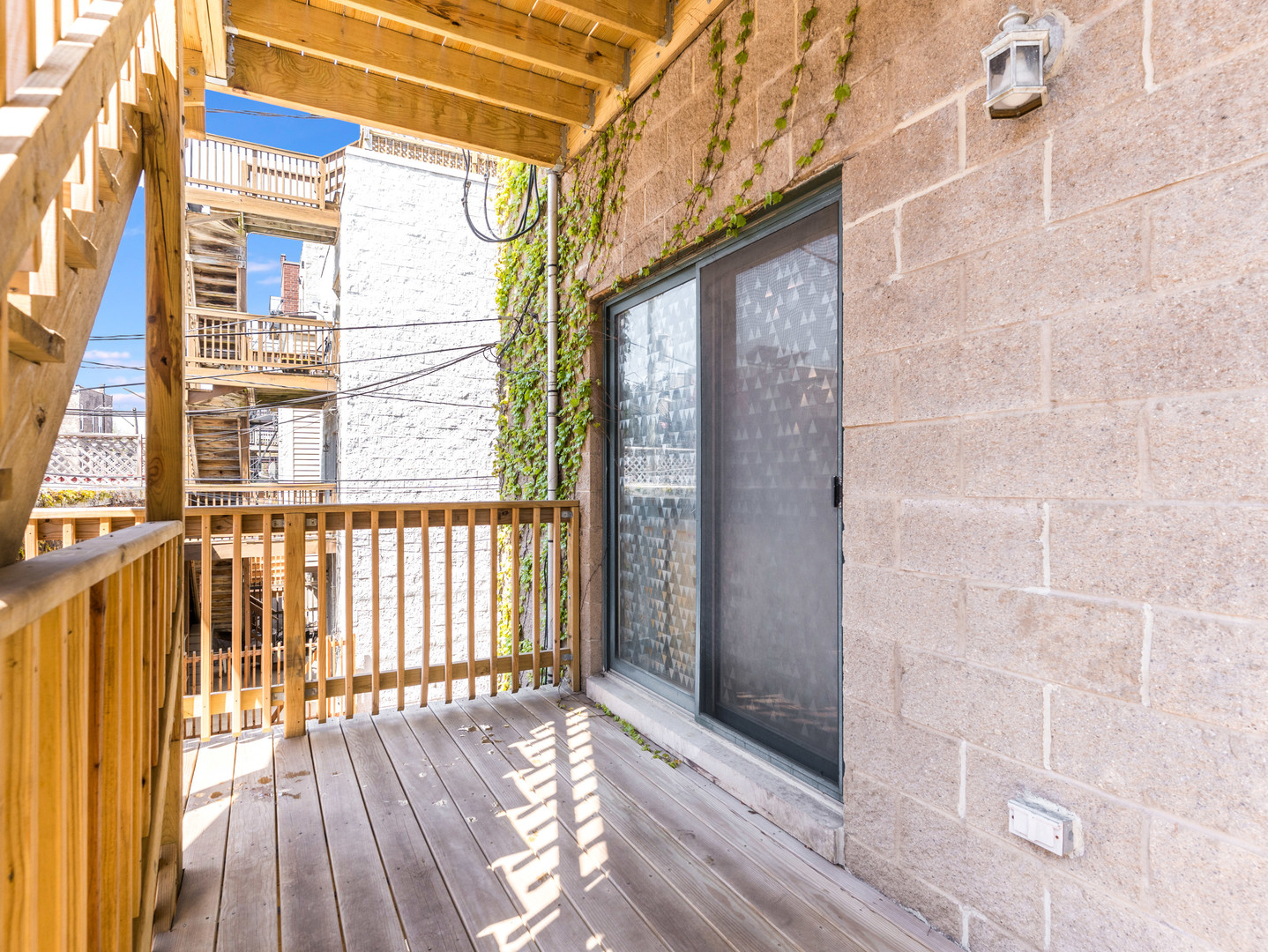 1335 West Fillmore Street, Unit B Chicago, IL 60607 - Photo 18 of 19 a view of a balcony with wooden floor