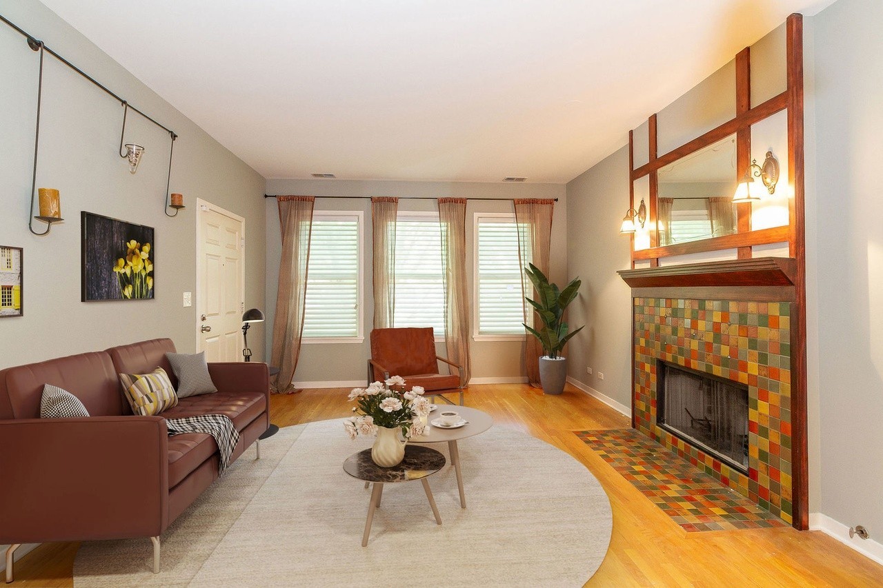 1335 West Fillmore Street, Unit B Chicago, IL 60607 - Photo 4 of 19 a living room with furniture a fireplace and a floor to ceiling window