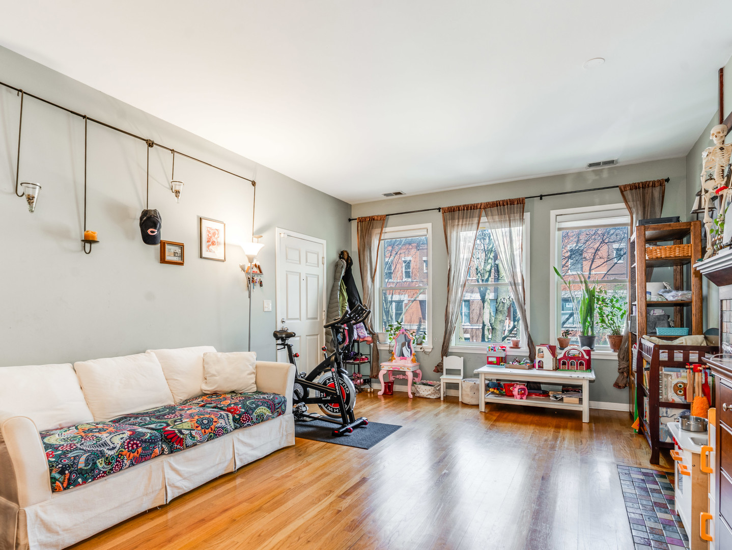 1335 West Fillmore Street, Unit B Chicago, IL 60607 - Photo 5 of 19 a living room with furniture and a large window
