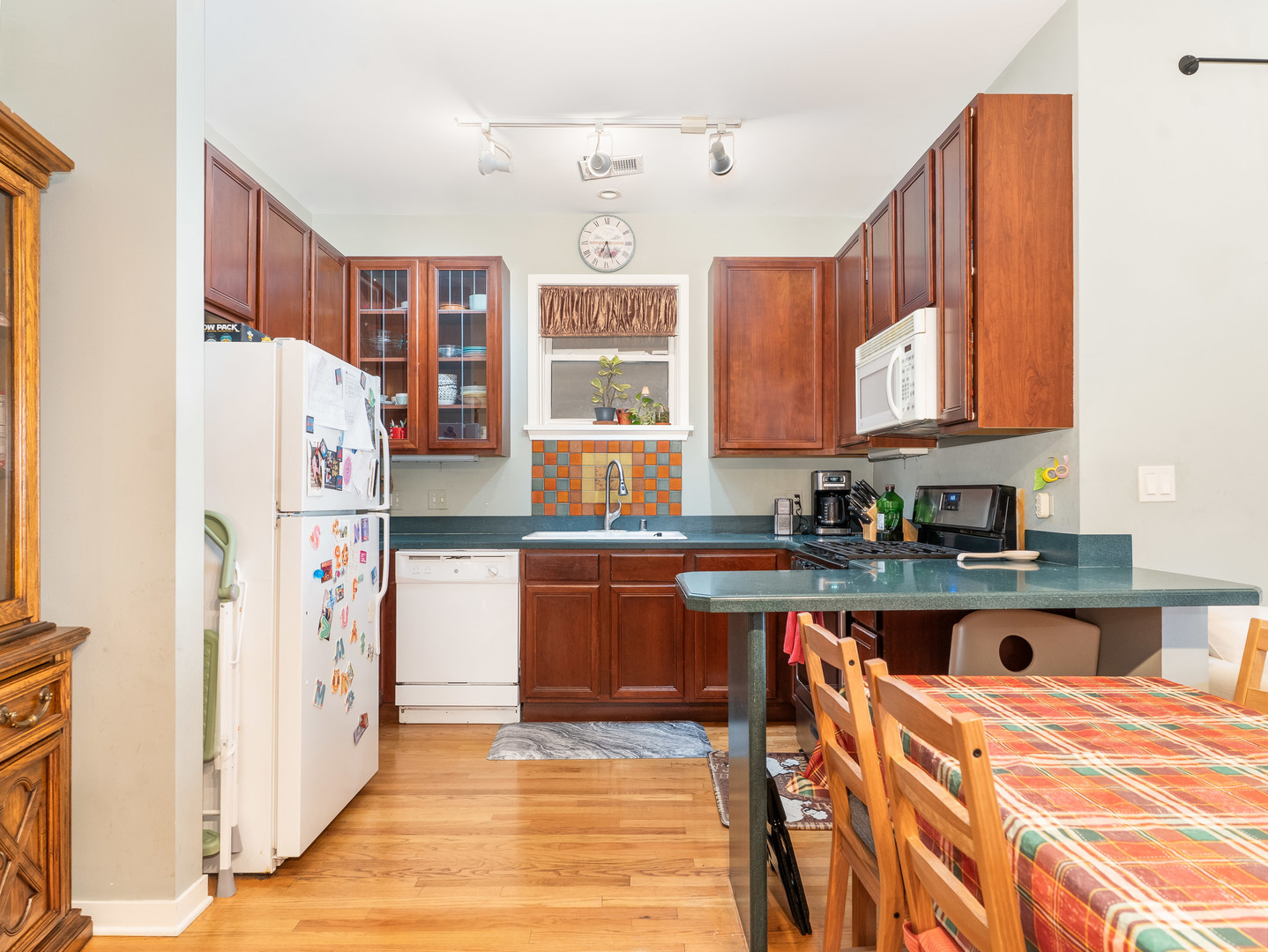 1335 West Fillmore Street, Unit B Chicago, IL 60607 - Photo 7 of 19 a kitchen with stainless steel appliances granite countertop a refrigerator and a stove top oven