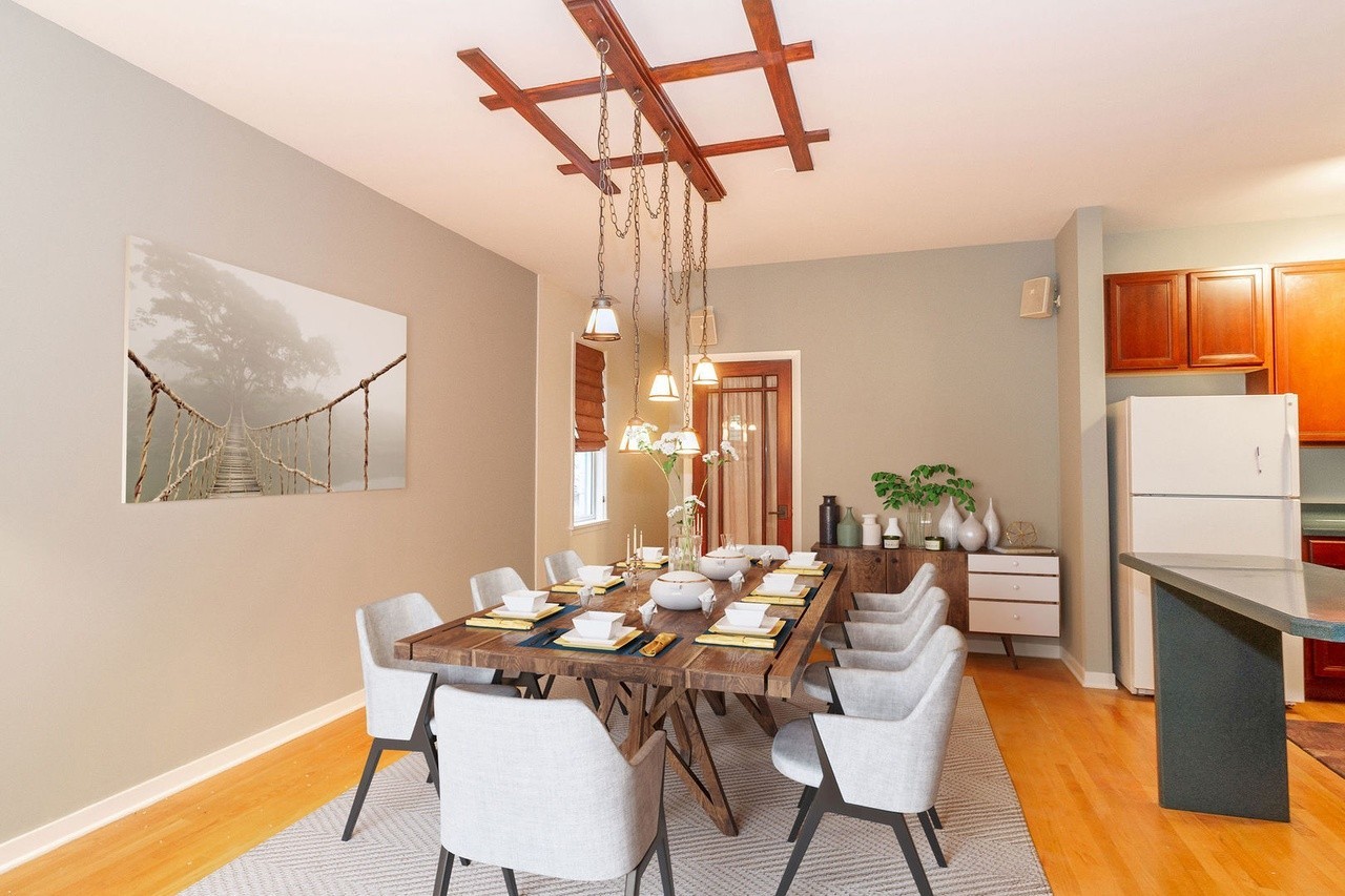 1335 West Fillmore Street, Unit B Chicago, IL 60607 - Photo 10 of 19 a view of a dining room with furniture and a chandelier