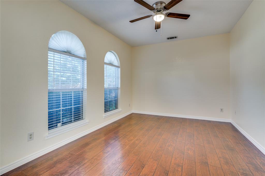 8305 Camden Court Rowlett, TX 75089 - Photo 4 of 18 Spare room with hardwood / wood-style floors and a ceiling fan