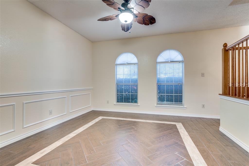 8305 Camden Court Rowlett, TX 75089 - Photo 10 of 18 Spare room featuring ceiling fan and parquet flooring
