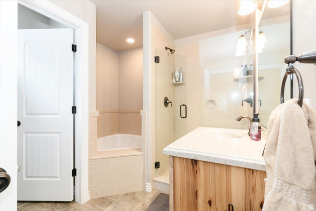 7203 East Cub River Road Preston, ID 83263 - Photo 15 of 33 Full bath featuring vanity, a shower stall, and a bath