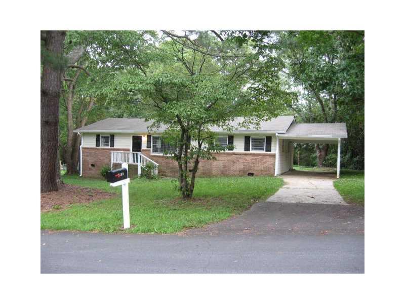 1806 Martin Road Southwest Marietta, GA 30008 - Photo 1 of 1 Exterior Front. Beautiful mature trees greet you as you enter the new covered carport.