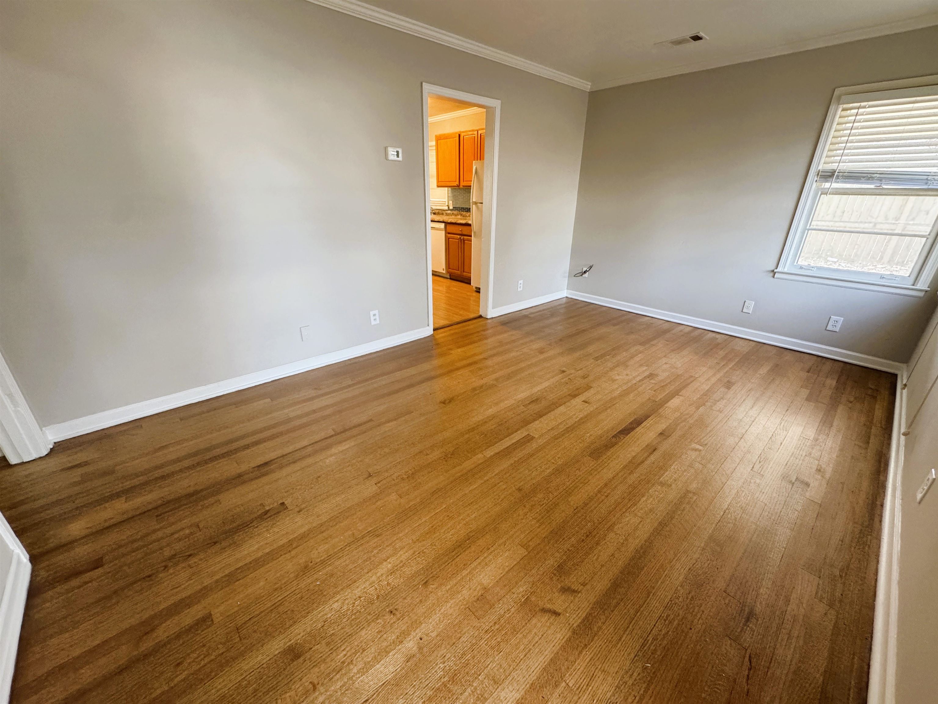 4781 Given Avenue Memphis, TN 38122 - Photo 3 of 15 Spare room with ornamental molding and light wood-type flooring