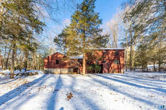 a view of a park with iron fence