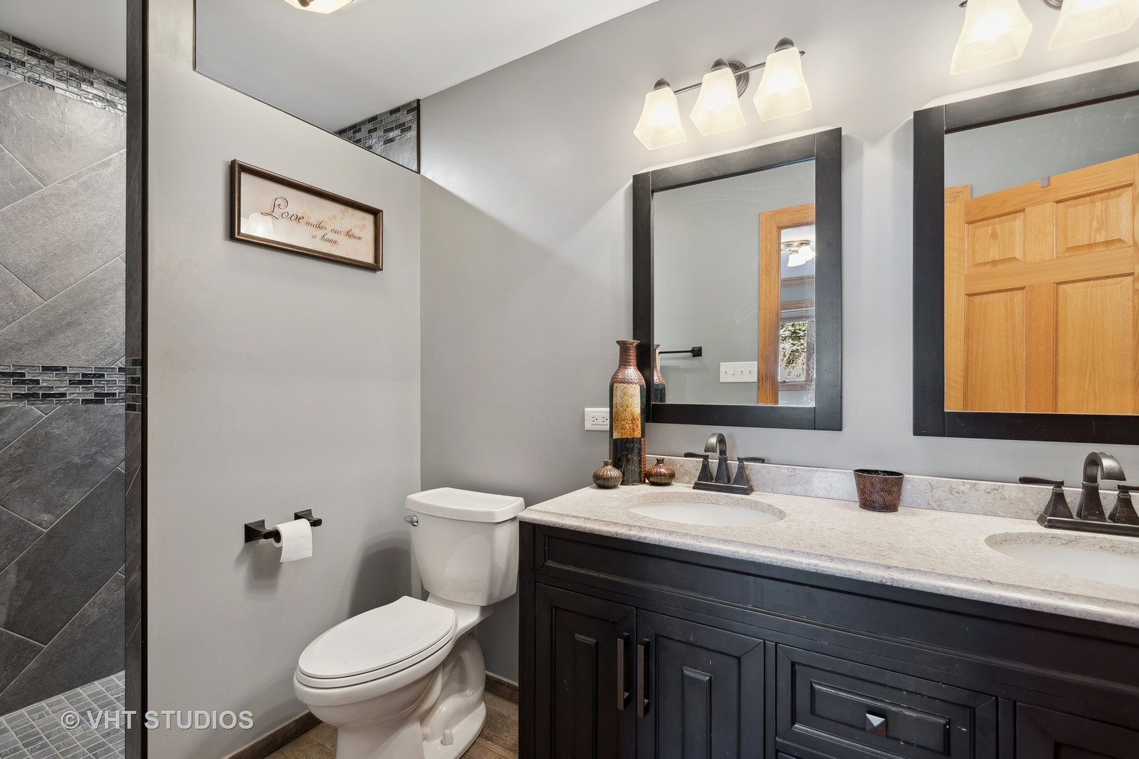 1907 Cherry Valley Road Woodstock, IL 60098 - Photo 18 of 56 a bathroom with a double vanity sink mirror and toilet