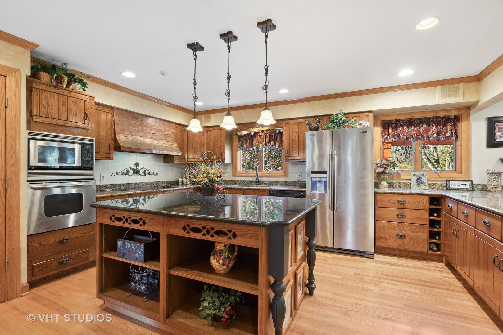 1907 Cherry Valley Road Woodstock, IL 60098 - Photo 2 of 56 a kitchen with stainless steel appliances granite countertop a stove and a refrigerator