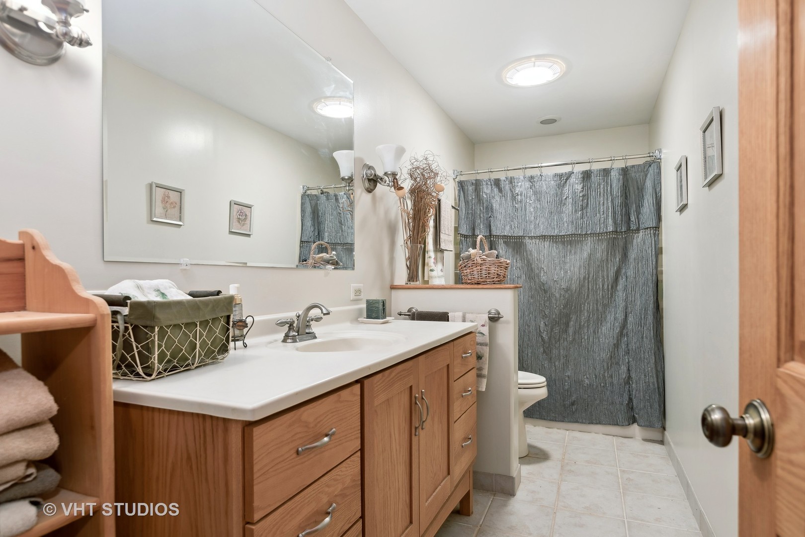 1907 Cherry Valley Road Woodstock, IL 60098 - Photo 22 of 56 a bathroom with a sink toilet and shower