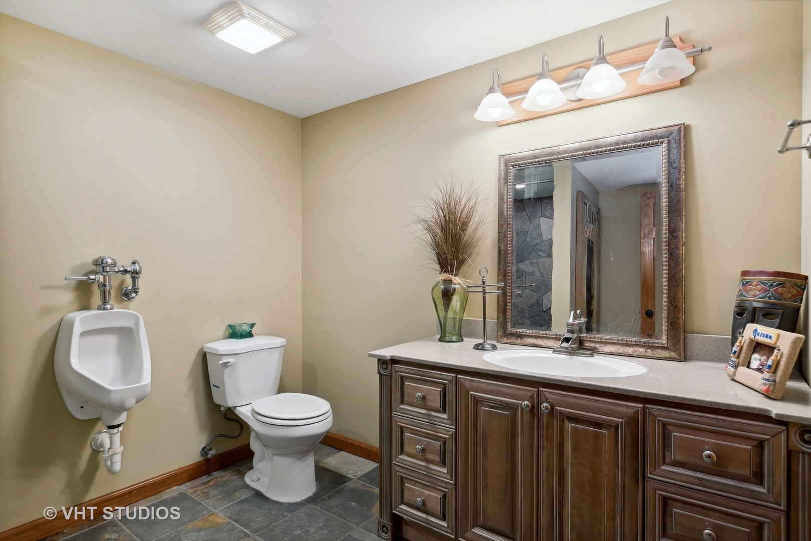 1907 Cherry Valley Road Woodstock, IL 60098 - Photo 28 of 56 a bathroom with a toilet a sink and mirror