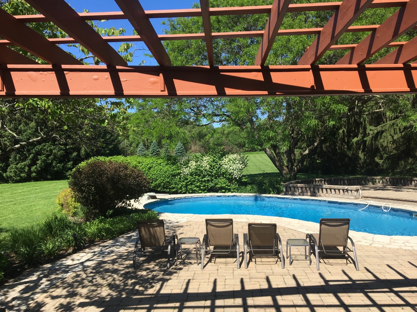 1907 Cherry Valley Road Woodstock, IL 60098 - Photo 30 of 56 a view of swimming pool with seating area and green space