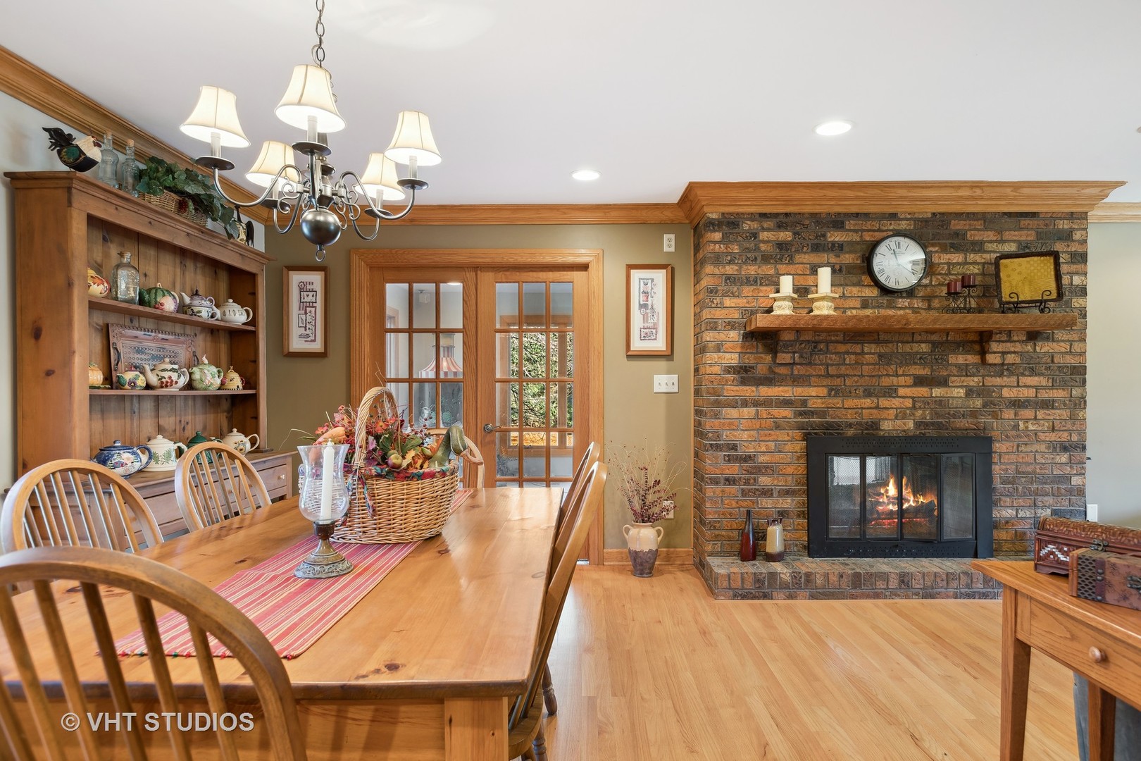 1907 Cherry Valley Road Woodstock, IL 60098 - Photo 3 of 56 a view of a dining room with furniture a chandelier and wooden floor