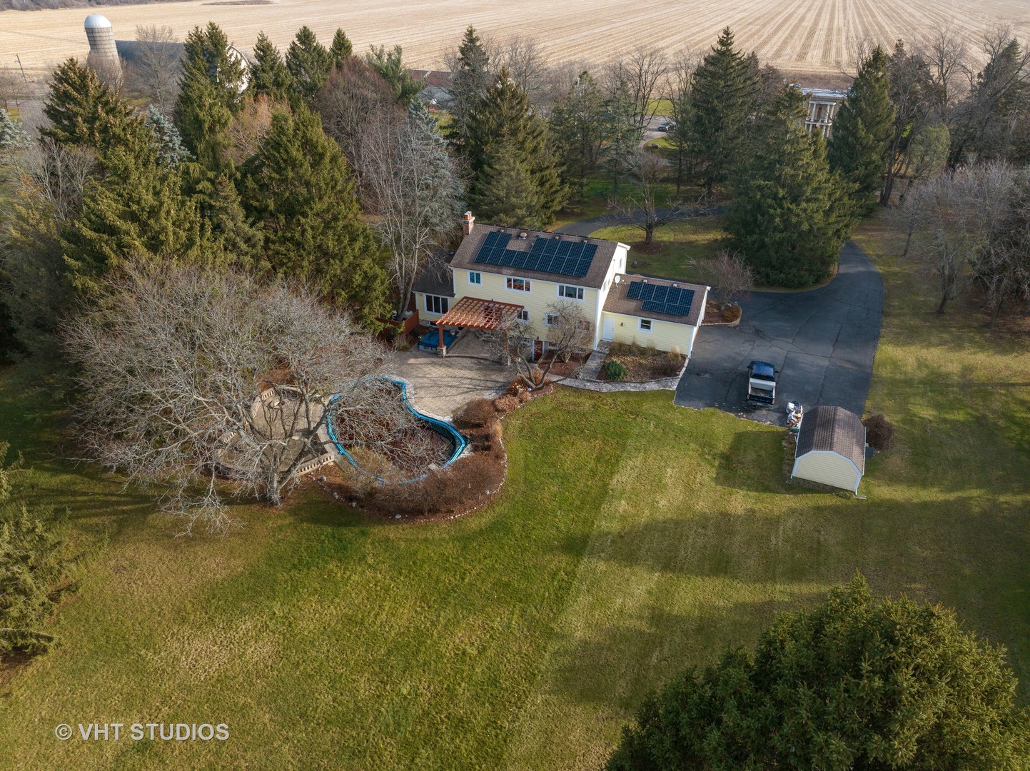1907 Cherry Valley Road Woodstock, IL 60098 - Photo 44 of 56 a view of a house with a yard