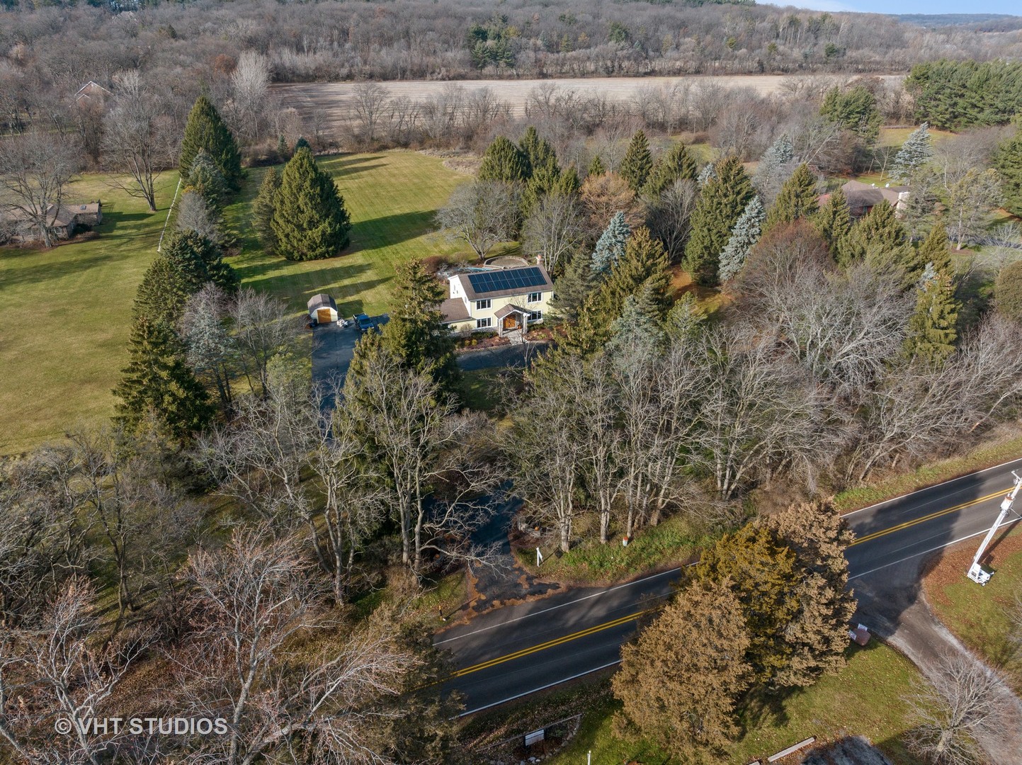 1907 Cherry Valley Road Woodstock, IL 60098 - Photo 46 of 56 a aerial view of a house with a yard and lake view