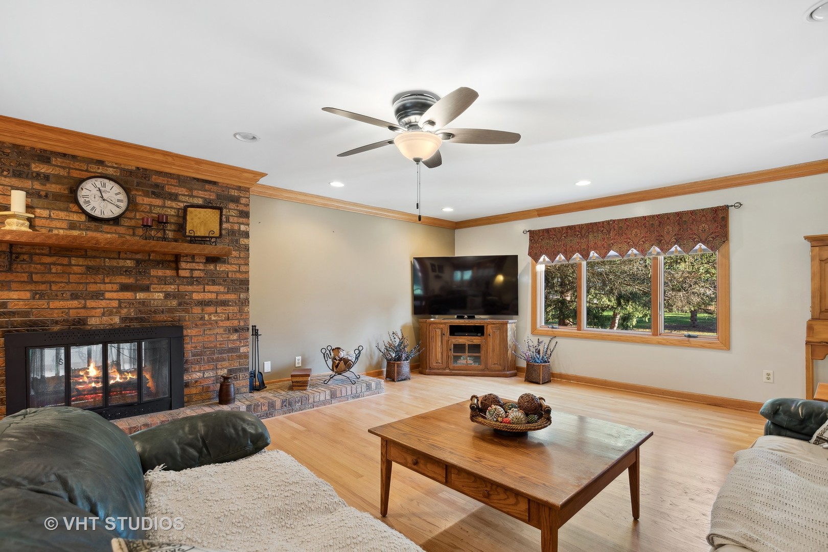 1907 Cherry Valley Road Woodstock, IL 60098 - Photo 8 of 56 a living room with furniture a flat screen tv and a window