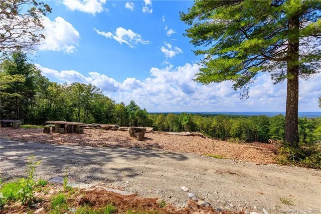 a view of a yard with table and chairs