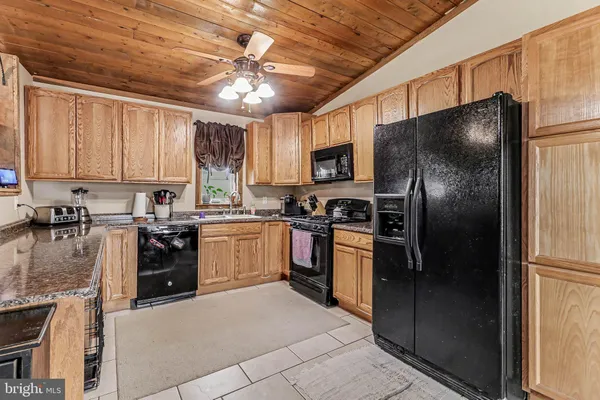 a kitchen with a refrigerator a sink and dishwasher