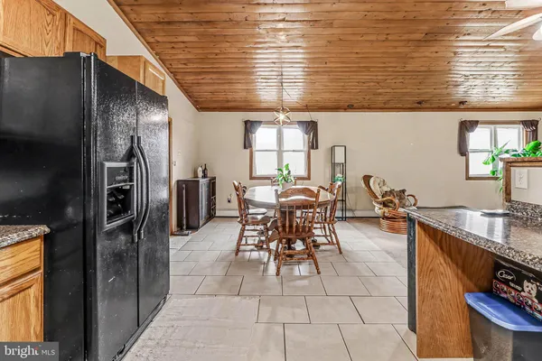a outdoor space with furniture a window and stainless steel appliances