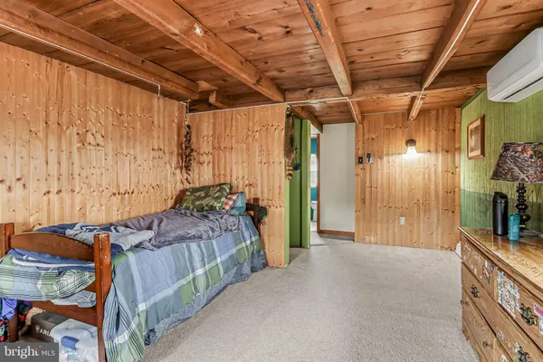 a bed room with a bed and a chandelier
