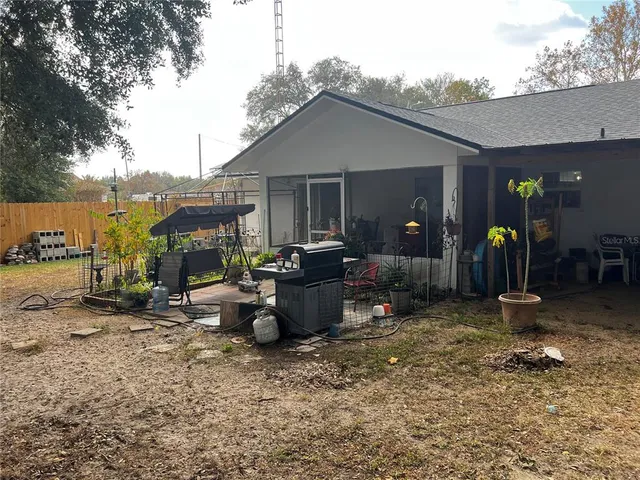a backyard of a house with seating space