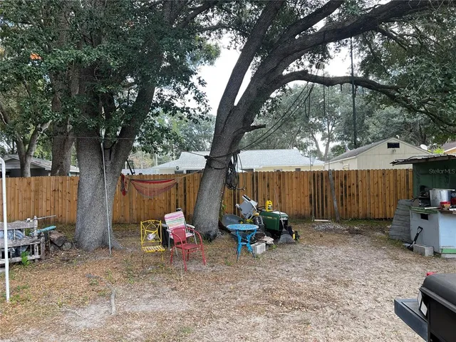 a kitchen with a stove a sink and a microwave