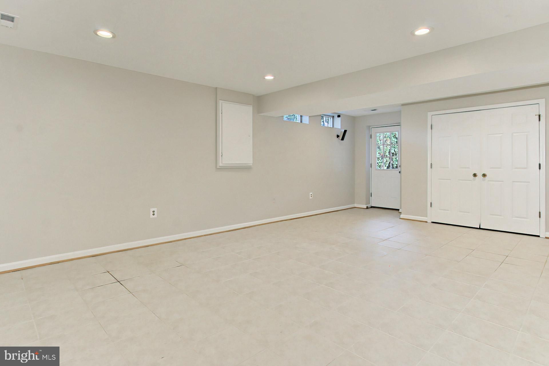 12567 Rock Ridge Road Herndon, VA 20170 - Photo 34 of 50 Finished Rec Room w Updated Tile Flooring in 09'