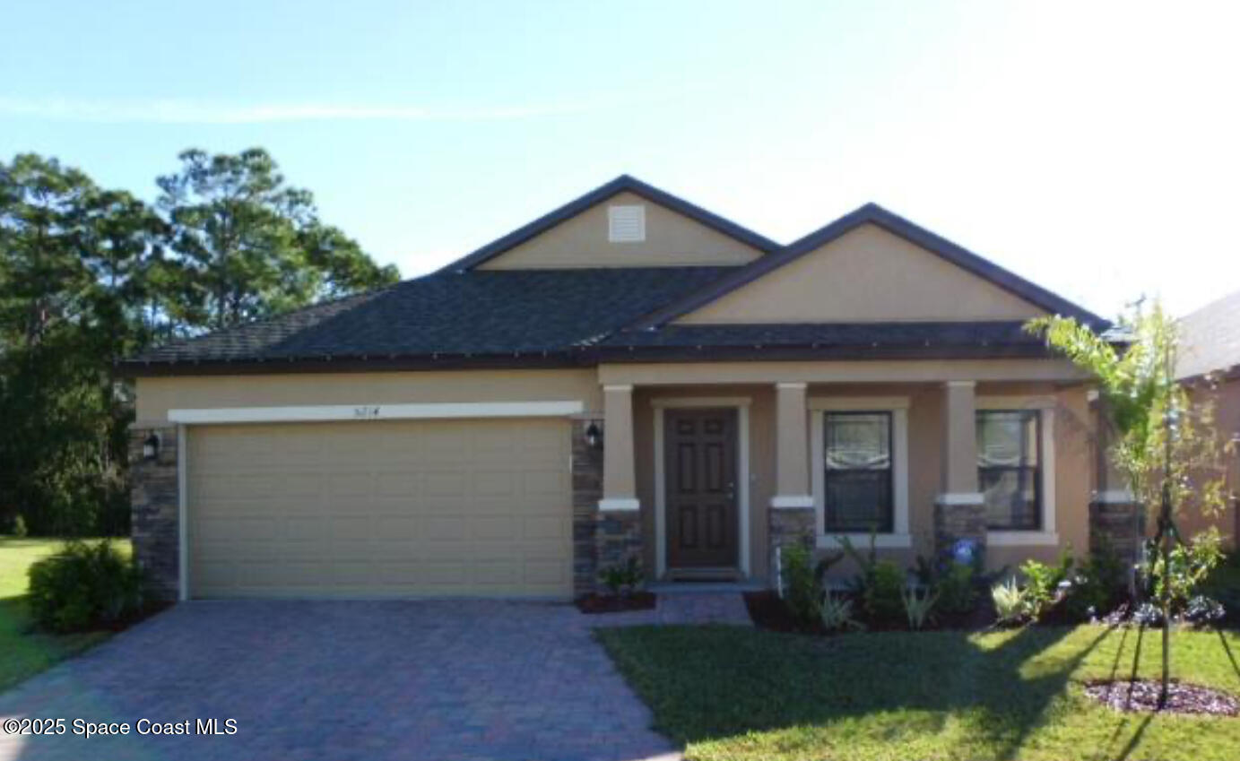 front view of a house and a yard