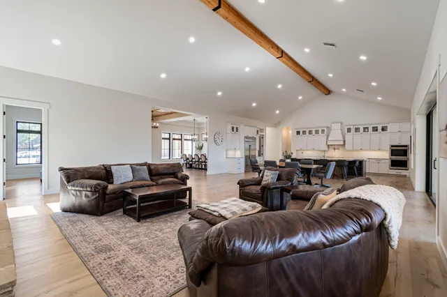 a view of a house with backyard porch and sitting area