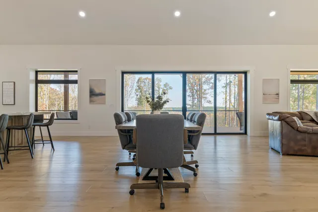 a kitchen with stainless steel appliances granite countertop a refrigerator and a stove top oven