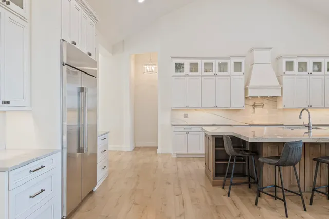 a front view of a house with a yard table and chairs
