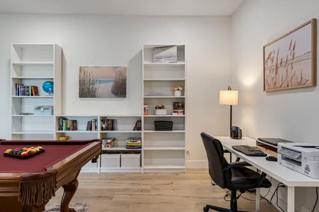 a view of a garage with parked cars