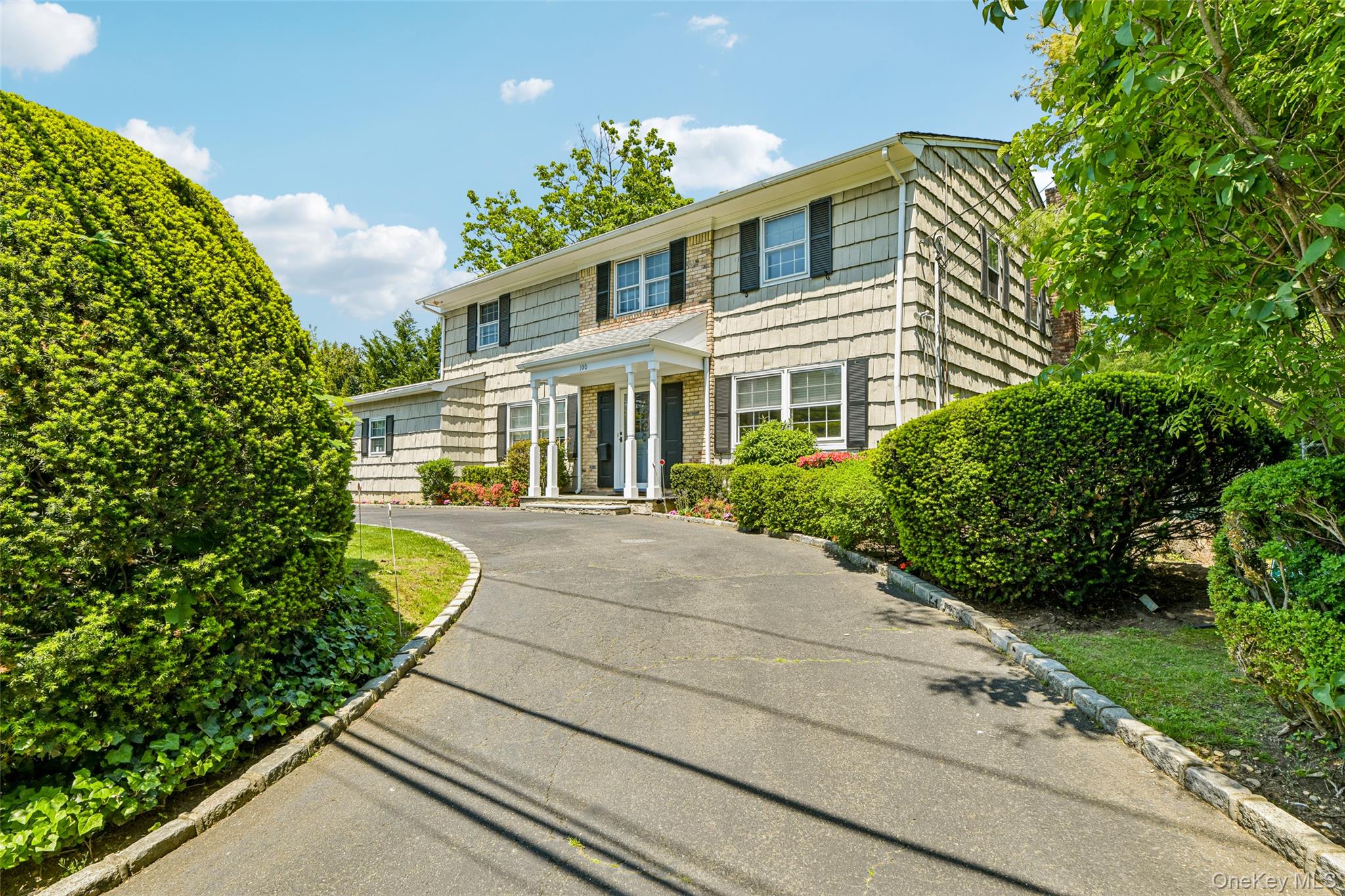 100 Hewlett Neck Road Woodmere, NY 11598 - Photo 1 of 45 a house view with a outdoor space