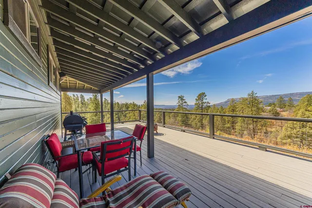 a view of sitting area with furniture and wooden floor