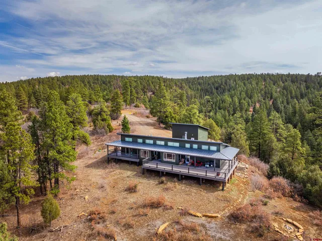 a wooden bench sitting in the middle of a lake