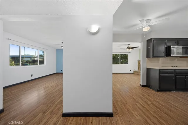 a view of a kitchen with a sink and a window
