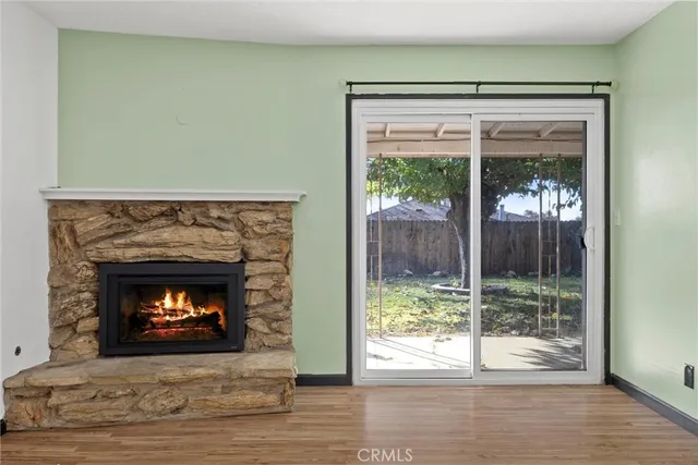 a room with a fireplace and a fireplace