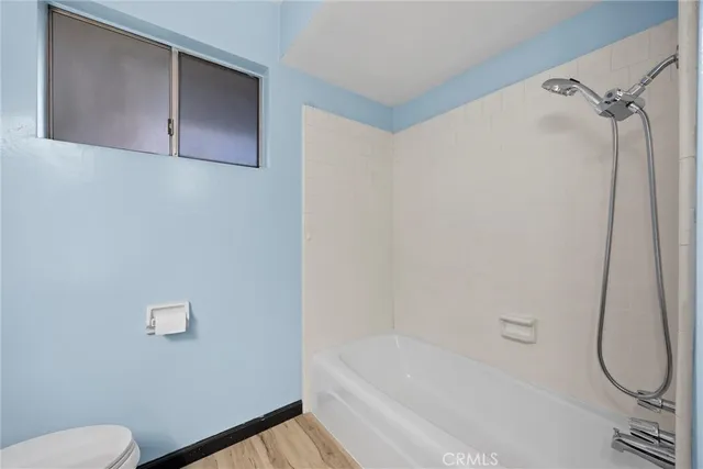 a bathroom with a bath tub and a shower