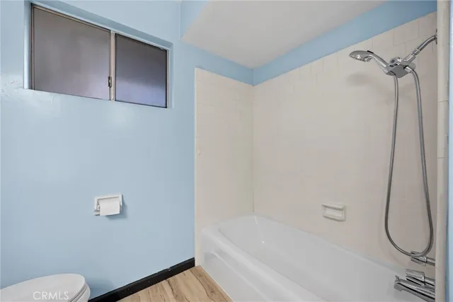 a bathroom with a bath tub and a shower