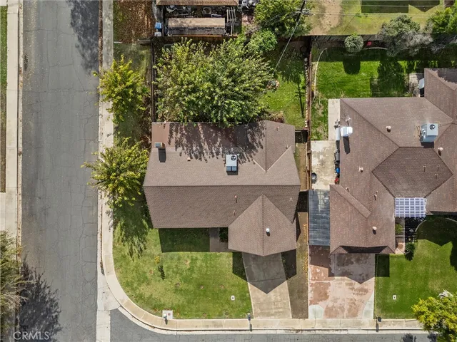 an aerial view of a house with a garden