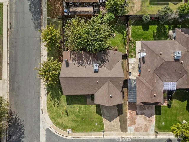 an aerial view of a house with a garden