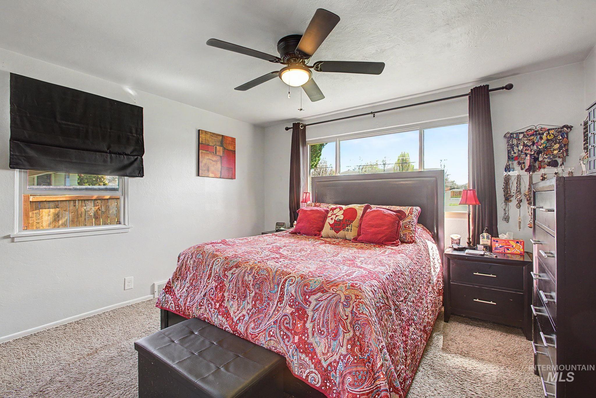 809 Bryden Avenue Lewiston, ID 83501 - Photo 13 of 42 Bedroom featuring light carpet and ceiling fan