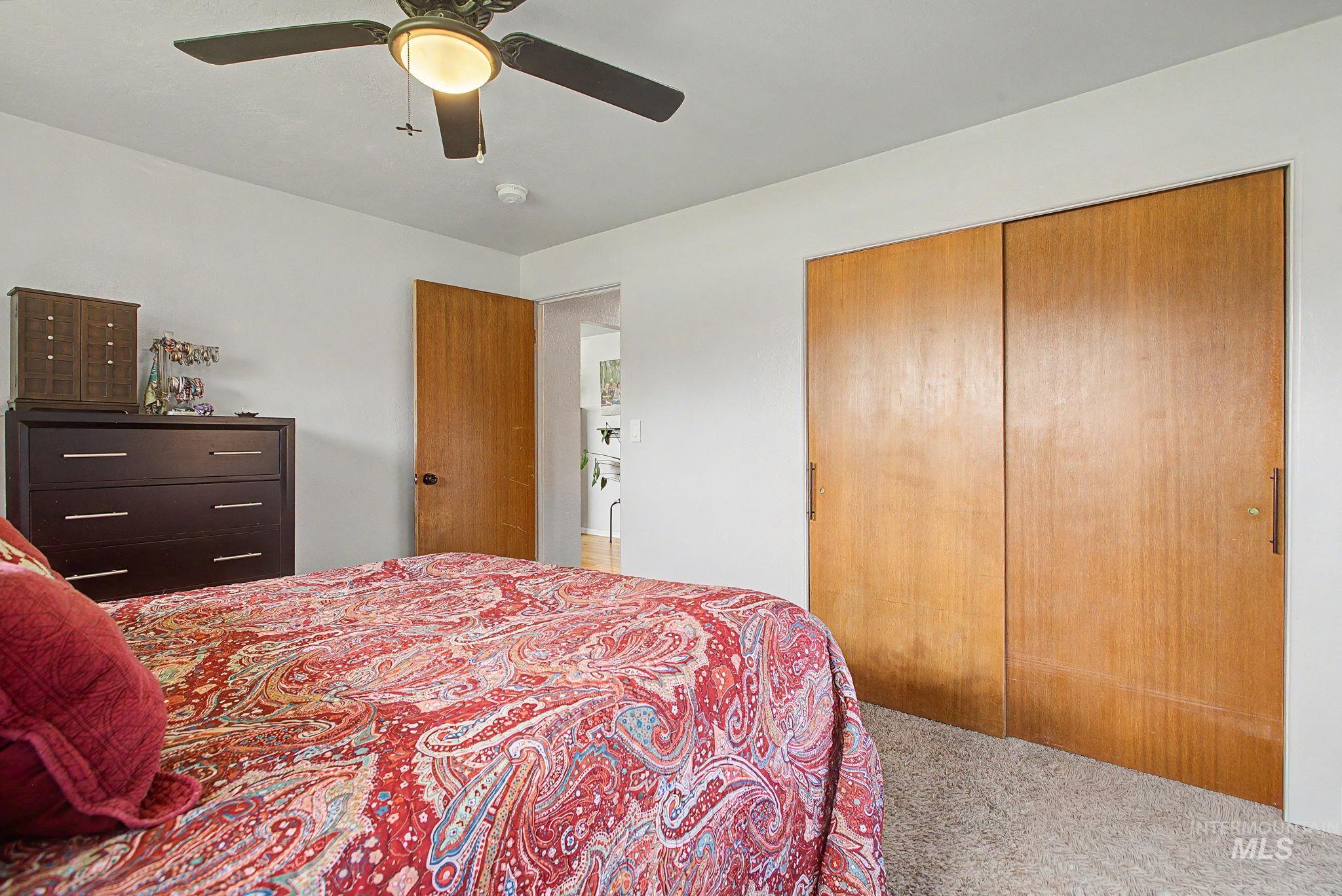 809 Bryden Avenue Lewiston, ID 83501 - Photo 14 of 42 Bedroom with a closet, carpet, and a ceiling fan