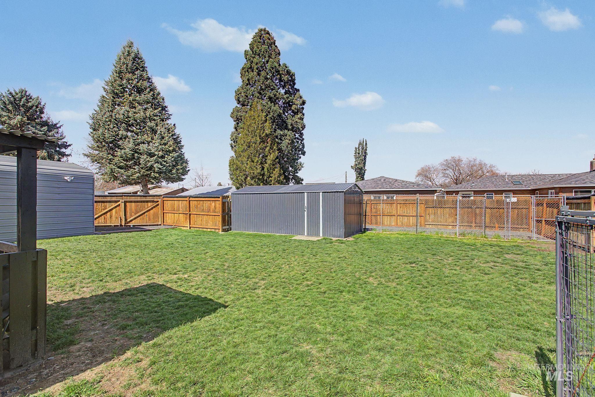 809 Bryden Avenue Lewiston, ID 83501 - Photo 34 of 42 Fenced backyard with a shed